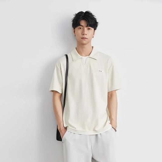 Polo à revers de couleur unie pour hommes, manches courtes, nouvelle mode d'été 2021, T-shirt ample et décontracté, faux haut deux pièces à manches mi-longues  COOLANDBAG