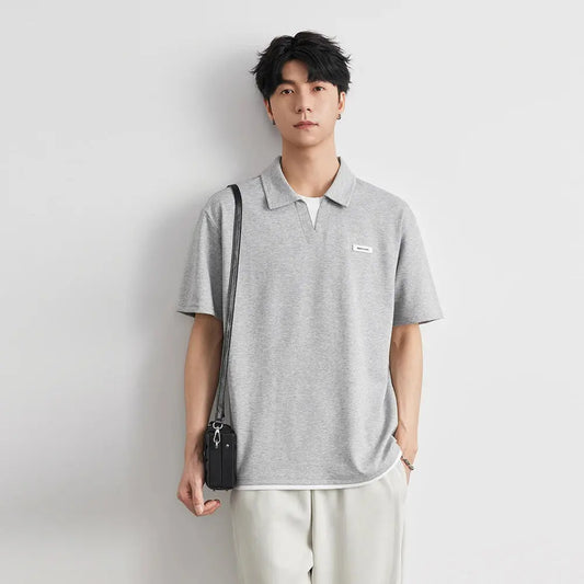 Polo à revers de couleur unie pour hommes, manches courtes, nouvelle mode d'été 2021, T-shirt ample et décontracté, faux haut deux pièces à manches mi-longues  COOLANDBAG
